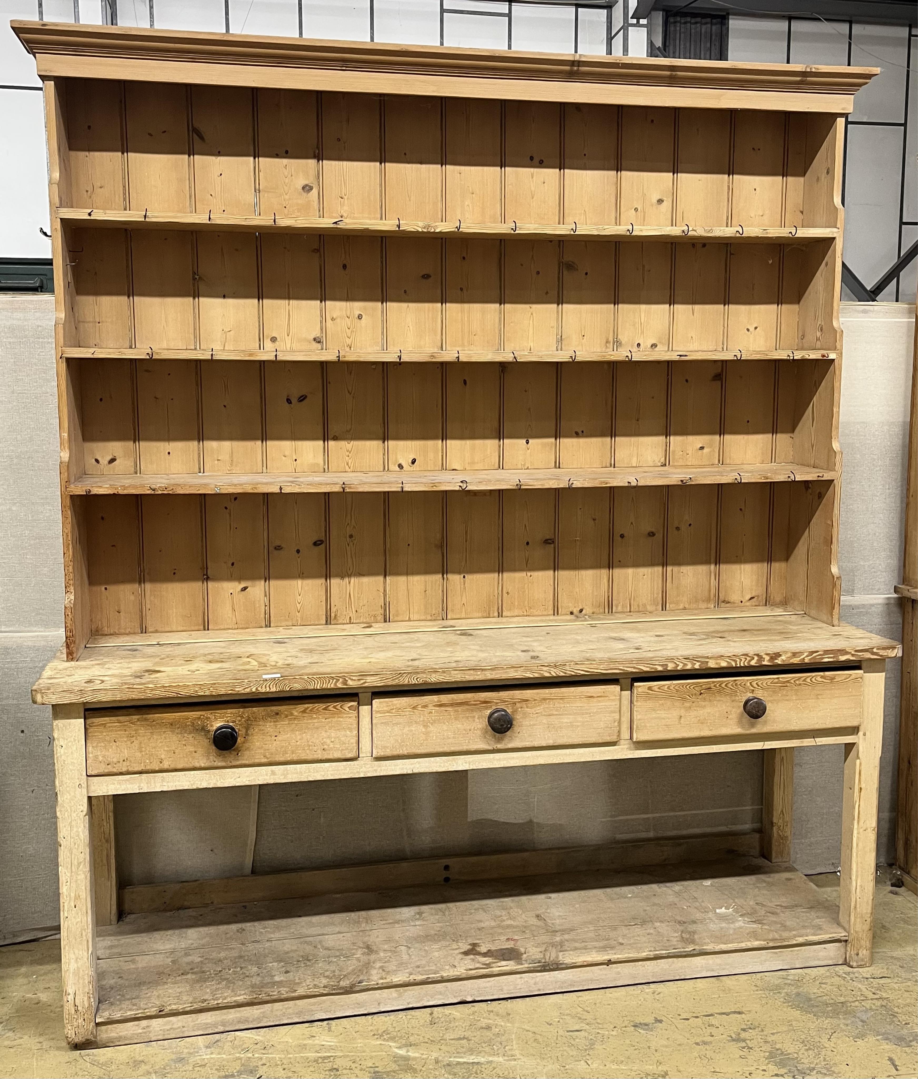 A Victorian pine potboard dresser with boarded rack, width 214cm, depth 55cm, height 88cm. Condition - fair